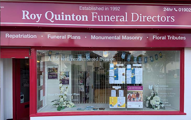 Picture of the front of Roy Quinton Funeral Directors with decorations for Dying Matters 2024.